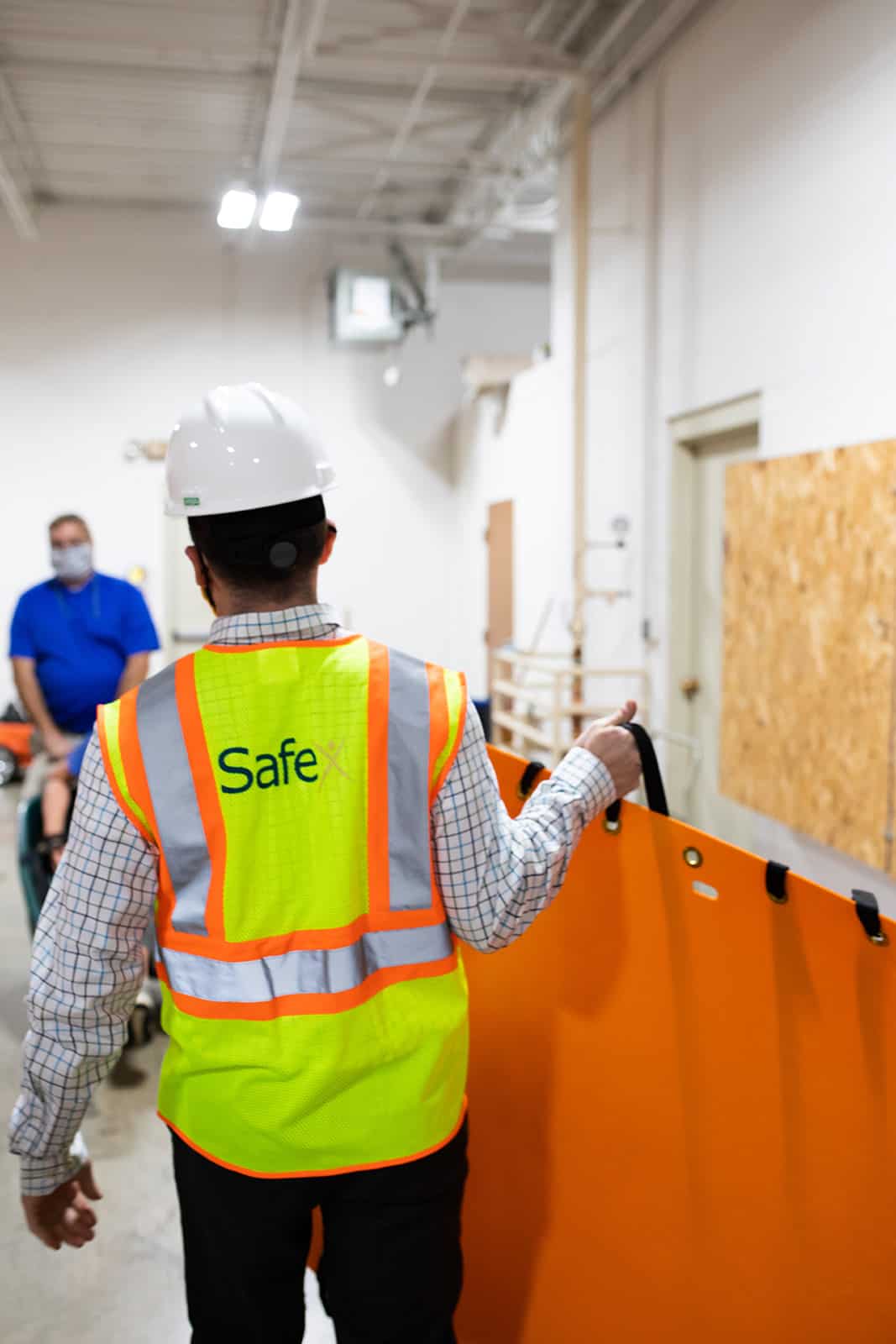 Safety consultant with high vis vest